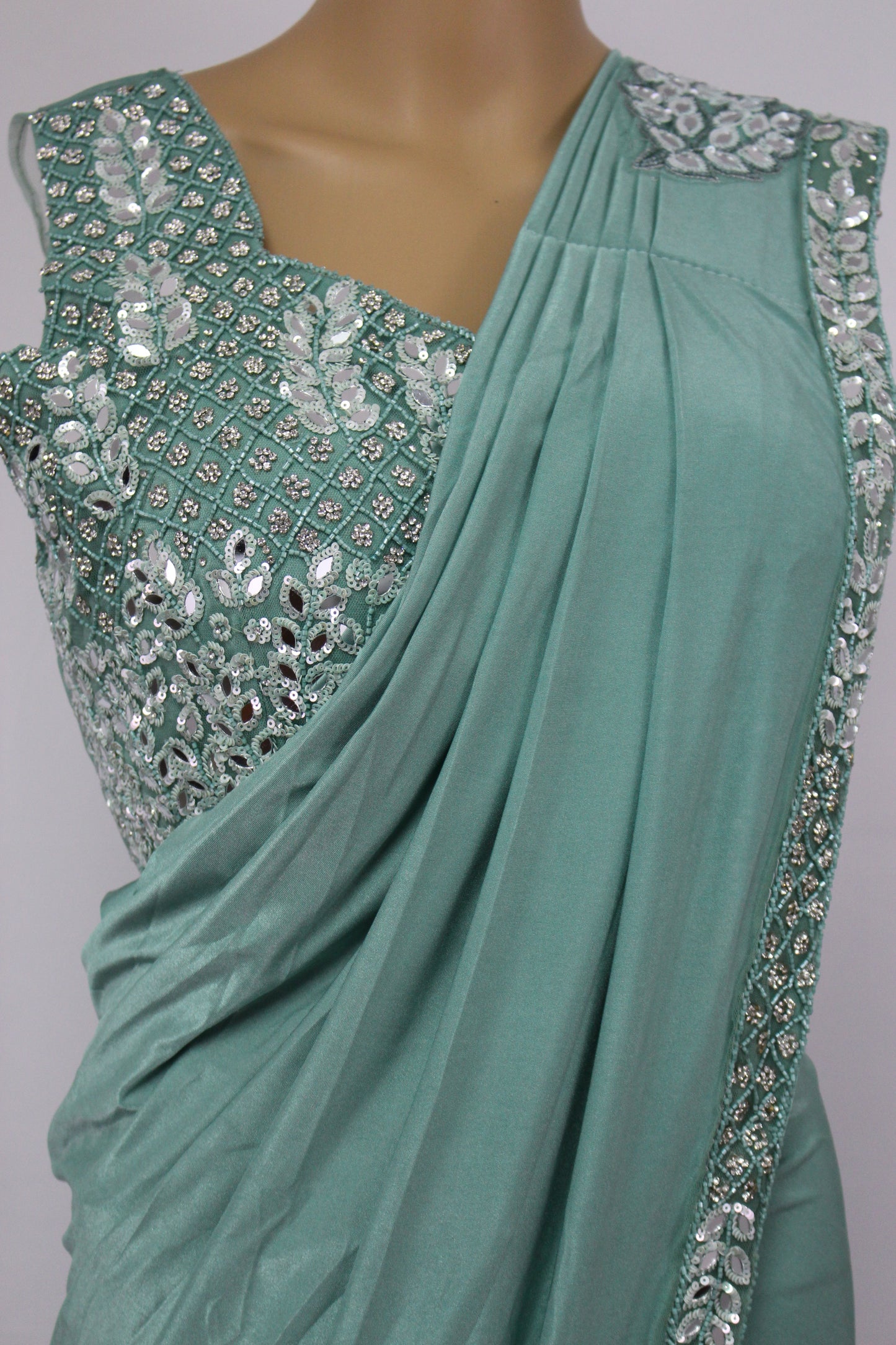 Exquisitely Handcrafted Sarees in Pine Green & Desert Rose