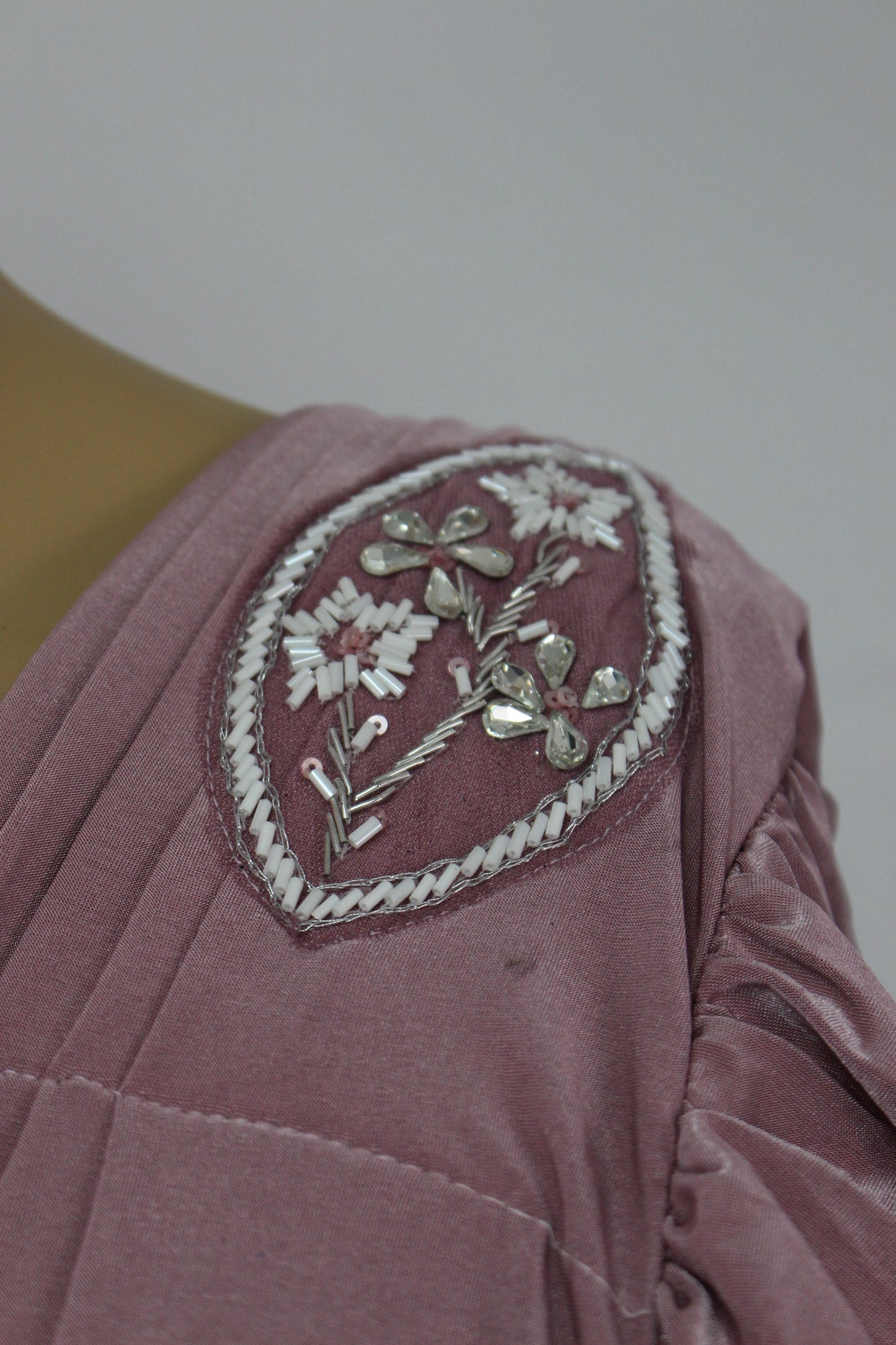 Elegantly designed deep pastel pink saree with hand made blouse and belt